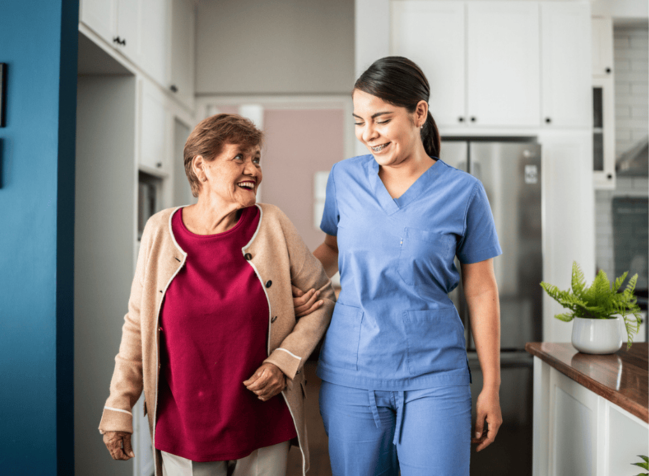 caregiver assisting an elderly lady in her home